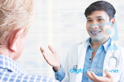 Doctor With Patient Stock Photo