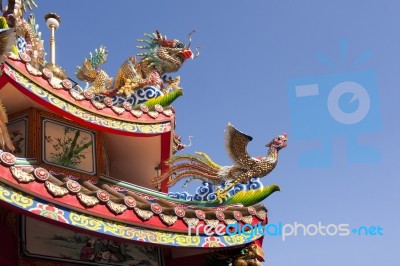 Dragon And Phoenix On The Temple Roof Stock Photo