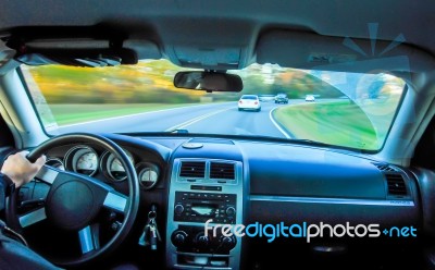 Driving In Car In Fall Stock Photo