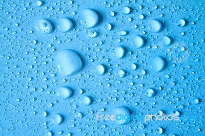 Drops Of Water On Blue Background Stock Photo