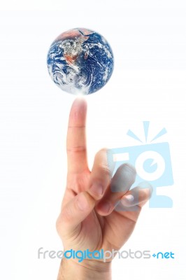Earth On Finger Stock Photo