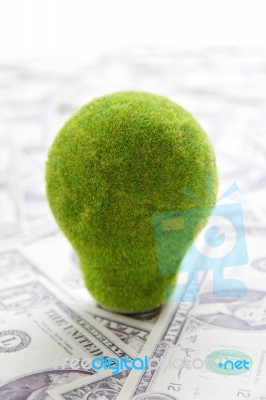 Eco Light Bulb with cash Stock Photo