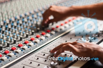 Editor Adjusting The Sound Mixer Stock Photo