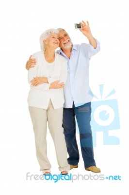 Elderly Couple With Camera Stock Photo