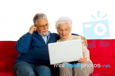 Elderly Couple With Laptop Stock Photo