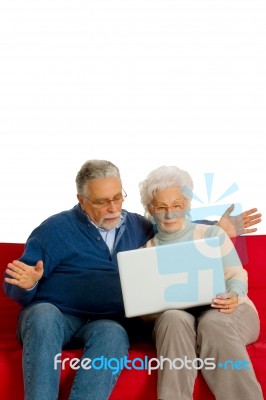 Elderly Couple With Laptop Stock Photo