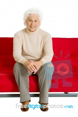 Elderly Woman On The Couch Stock Photo