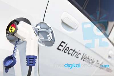 Electric Car Charging Stock Photo