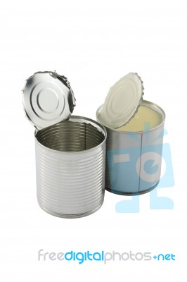 Empty Opened In Front Of Full Closed Sweet Milk Tin Can Stock Photo