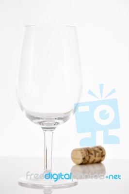 Empty Red Wine Glass And Wine Bottle Cork Stock Photo
