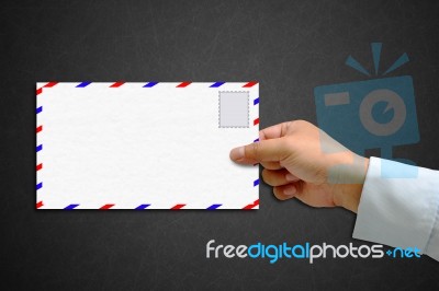 Envelope And Stamp In The Hand Stock Image