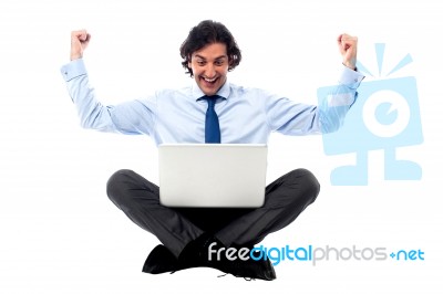 Excited Young Professional With Laptop Stock Photo