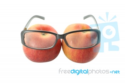 Eye Glasses Of Two Apples On White Background Stock Photo