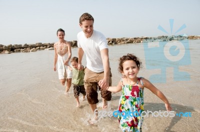 Family  In The Beach Stock Photo