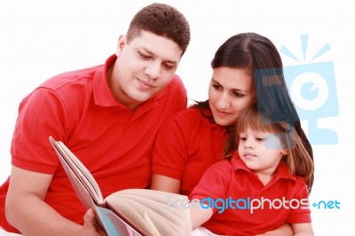Family Reading Book Stock Photo