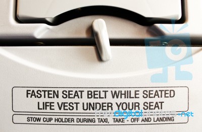 Fasten Seat Belt While Seated Stock Photo