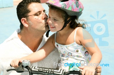 Father Kissing His Daughter Stock Photo