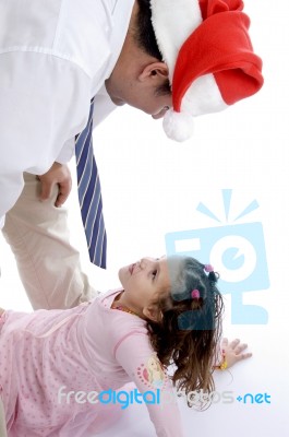 Father Wearing Christmas hat Stock Photo