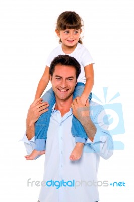 Father With Daughter On Shoulder Stock Photo