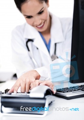 Female Doctor Dialing The Phone Stock Photo