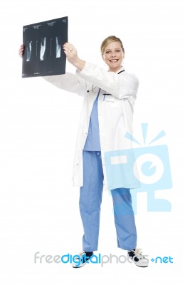 Female Doctor Holding X Ray Report Stock Photo
