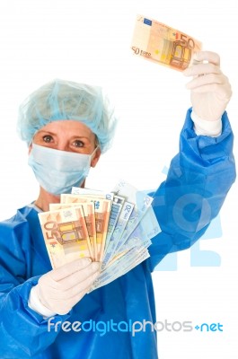 Female Doctor With Money Stock Photo