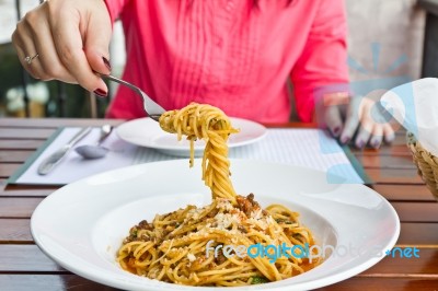 Female Eating Spaghetti In Dining Stock Photo