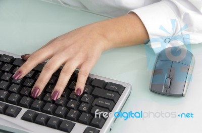 female Hand Operating Keyboard Stock Photo