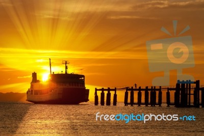 Ferry Boat At Sunset Stock Photo