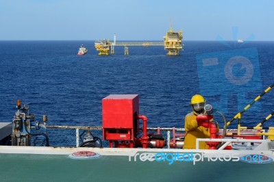 Fireman Is Guarding For Offshore Helicopter Before Start Up Engi… Stock Photo