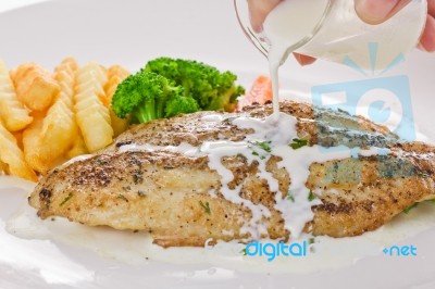 Fish Steak With Sauce Stock Photo