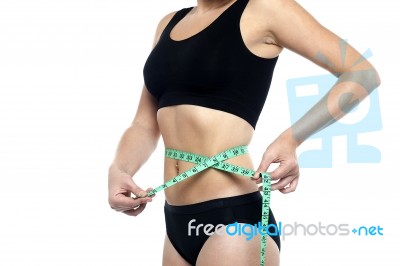 Fit Woman Measuring Her Waist, Cropped Image Stock Photo