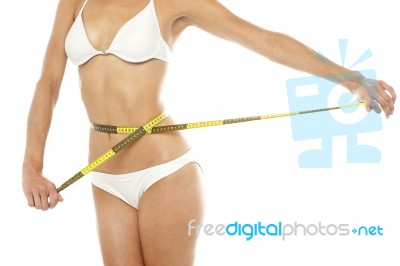 Fit Woman Measuring Her Waist, Cropped Image Stock Photo