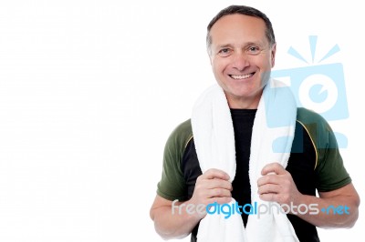 Fitness Trainer With Towel Around His Neck Stock Photo