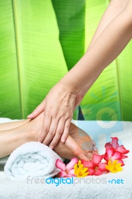 Foot Massage With Green Leaf Background Stock Photo