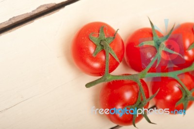Fresh Cherry Tomatoes On A Cluster Stock Photo