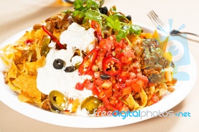 Fresh Nachos And Vegetable Salad With Meat Stock Photo
