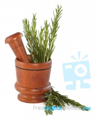 Fresh Rosemary Herb In Wooden Mortar With Pestle Stock Photo