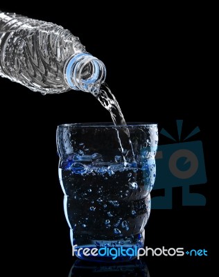Freshness Cool And Clean Drinking Water Pouring To Blue Glass Is… Stock Photo