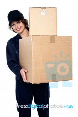 Friendly Delivery Woman At Your Doorstep Stock Photo