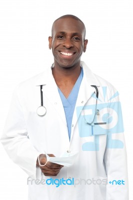 Friendly Middle Aged Male Doctor Posing Stock Photo