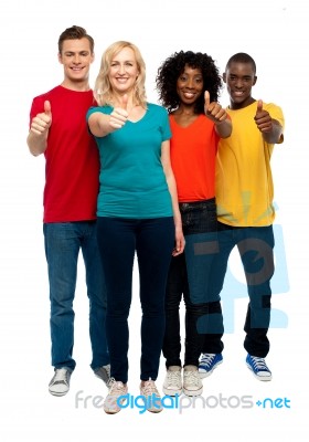 Friends showing thumbs up Stock Photo