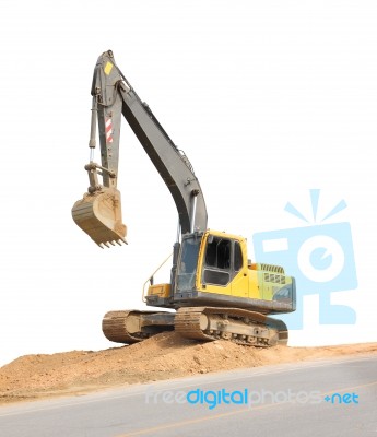 Front Side Of Old Backhoe Beside Road On White Background Stock Photo