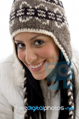 Front View Of Pleased Female With Woolen Cap Stock Photo