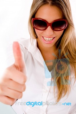 Front View Of Smiling Female With Thumbs Up Stock Photo