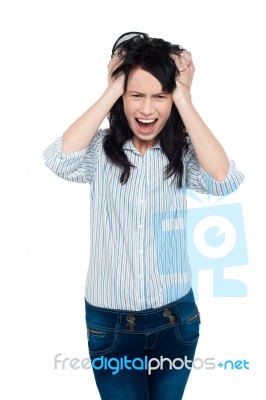 Frustrated Young Lady Screaming Loud Stock Photo
