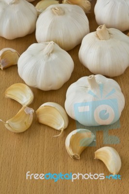 Garlic On Wooden Board Stock Photo