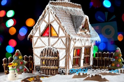 Gingerbread House And Snowman Stock Photo