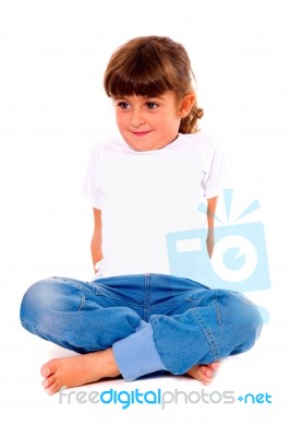 Girl Child Sitting With Leg Crossed Stock Photo