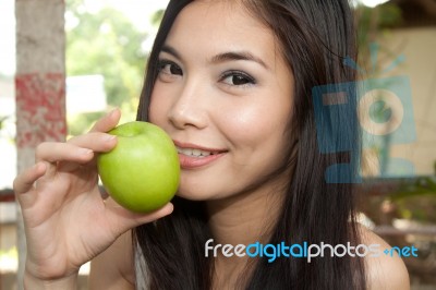 Girl Holding Green Apple Stock Photo